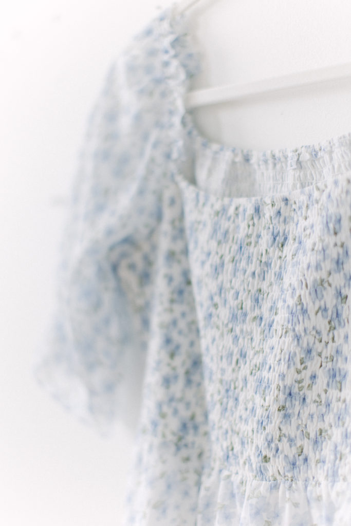 Close up of blue floral dress provided by Boston baby photographer Corinne Isabelle
