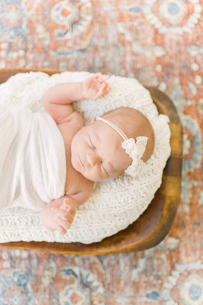 Newborn baby sleeping on a blanket during photo session with Boston Newborn Photographer Corinne Isabelle