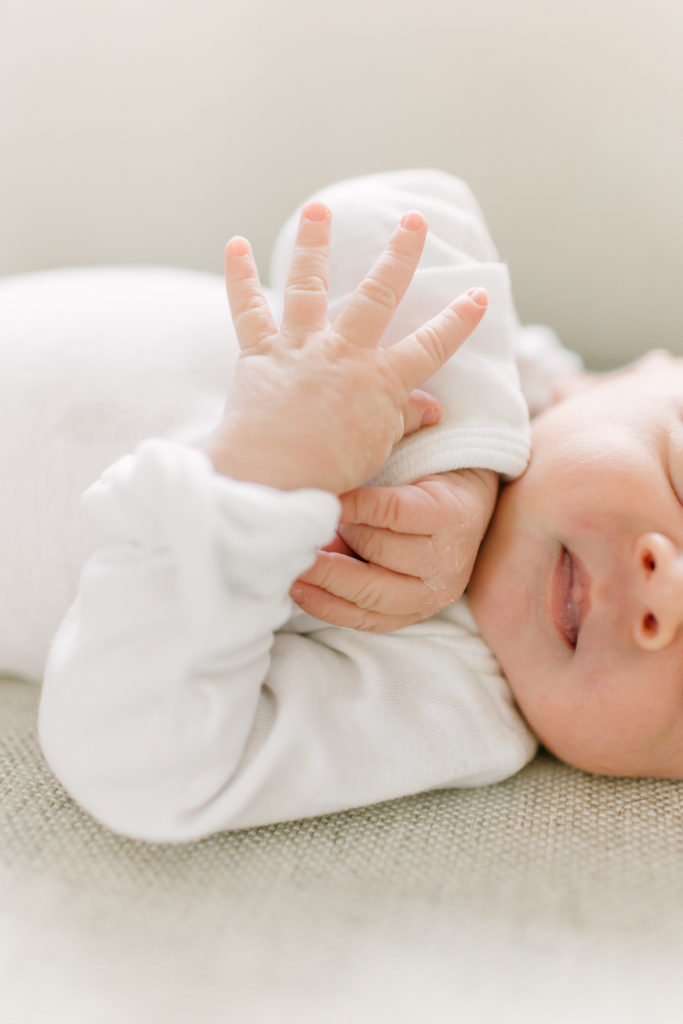 Close up of baby's hands during newborn photo session with Boston Newborn Photographer Corinne Isabelle