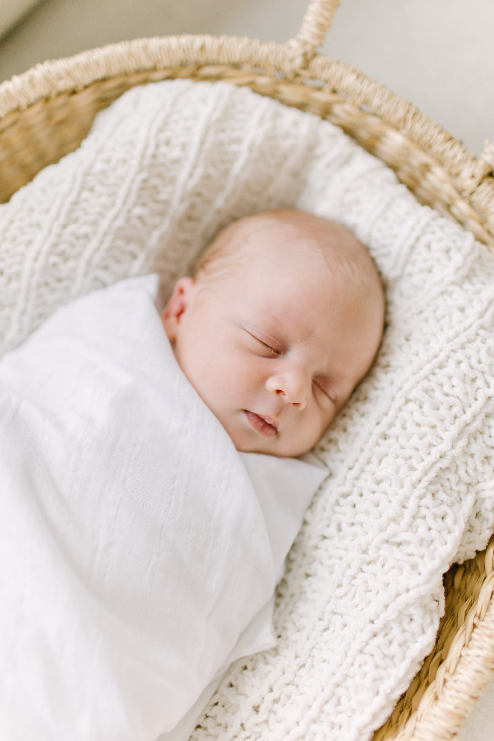 Close up of newborn baby boy during photo session with Natick newborn photographer Corinne Isabelle